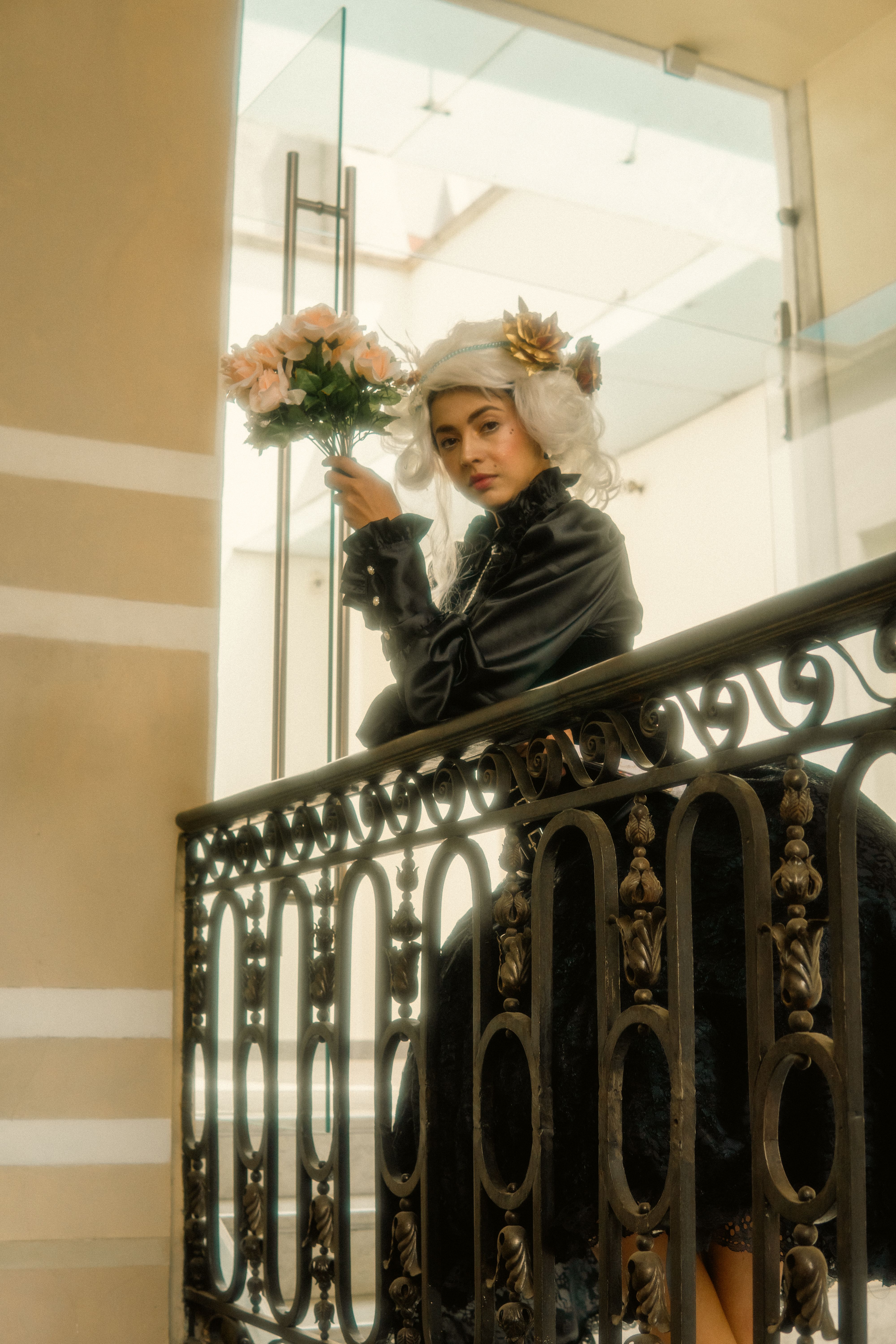 A woman in a black dress holding a bouquet of flowers · Free Stock Photo