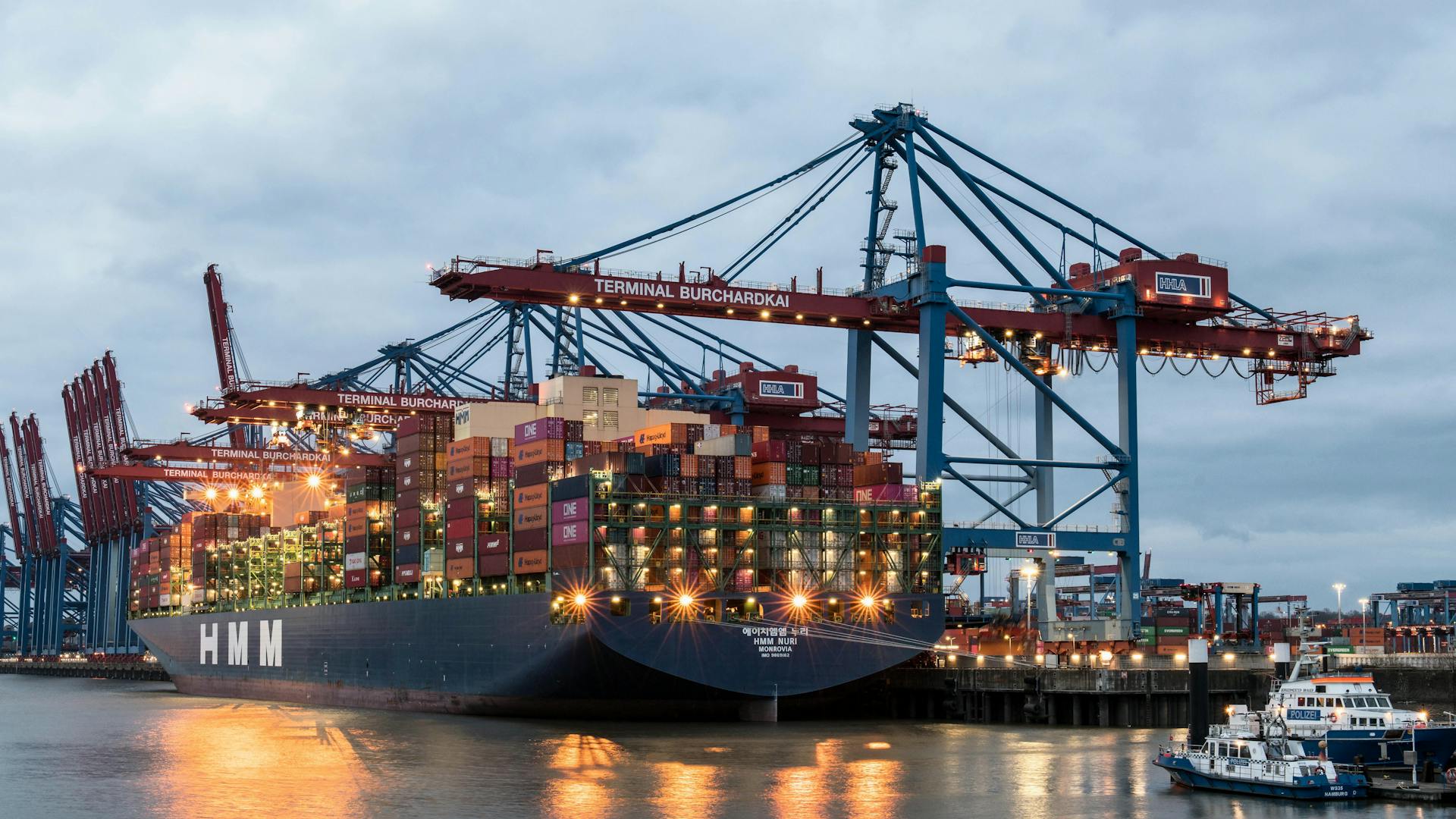 Container ship in the Port of Hamburg at Terminal Burchardkai, showcasing global trade.