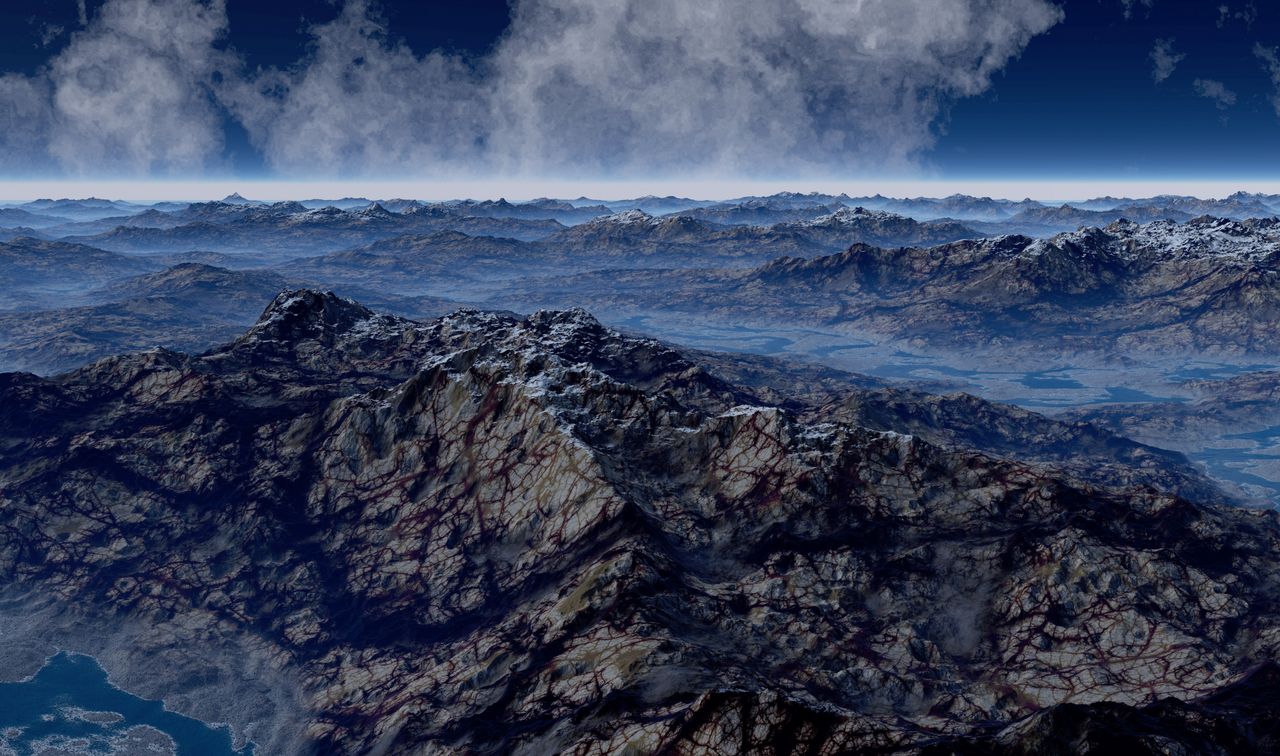 breathtaking view of a vast foggy mountain range under a dramatic sky