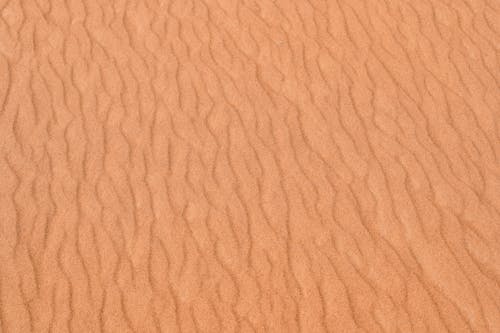 Sand dunes in the desert with a pattern of lines