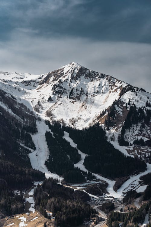 A snowy mountain with a ski slope on it