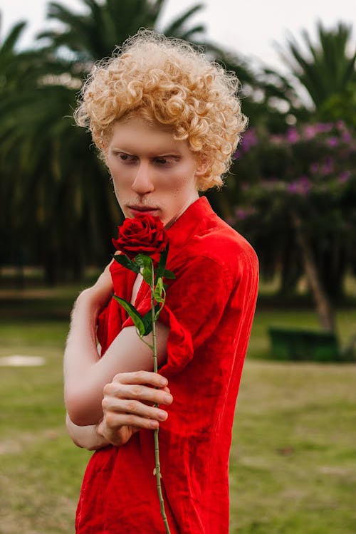 Man Holding Red Rose Flower