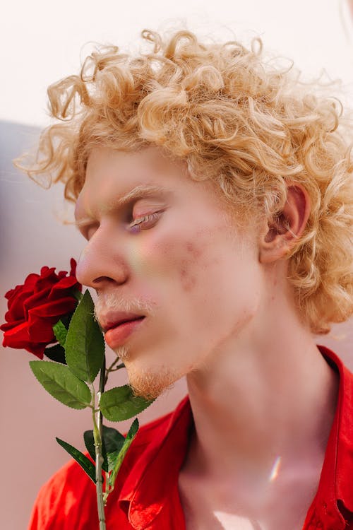 Unknown Celebrity Holding Red Rose