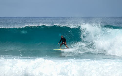 Free Photo of Man Surfing During Daytime Stock Photo