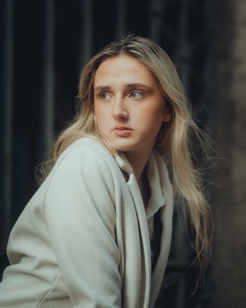 Portrait of Blonde Woman Wearing a White Coat 