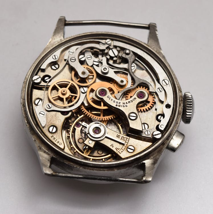 A watch with gears and gears on the back