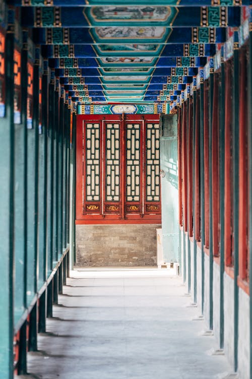 A long corridor with red and blue painted walls