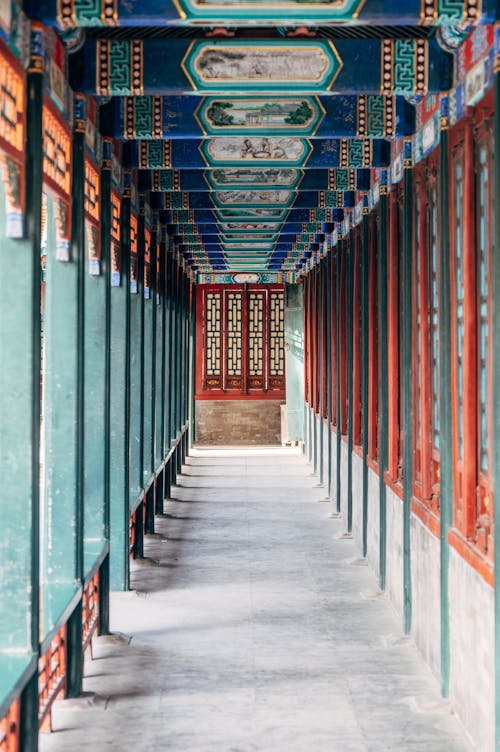 A long corridor with red and blue painted walls