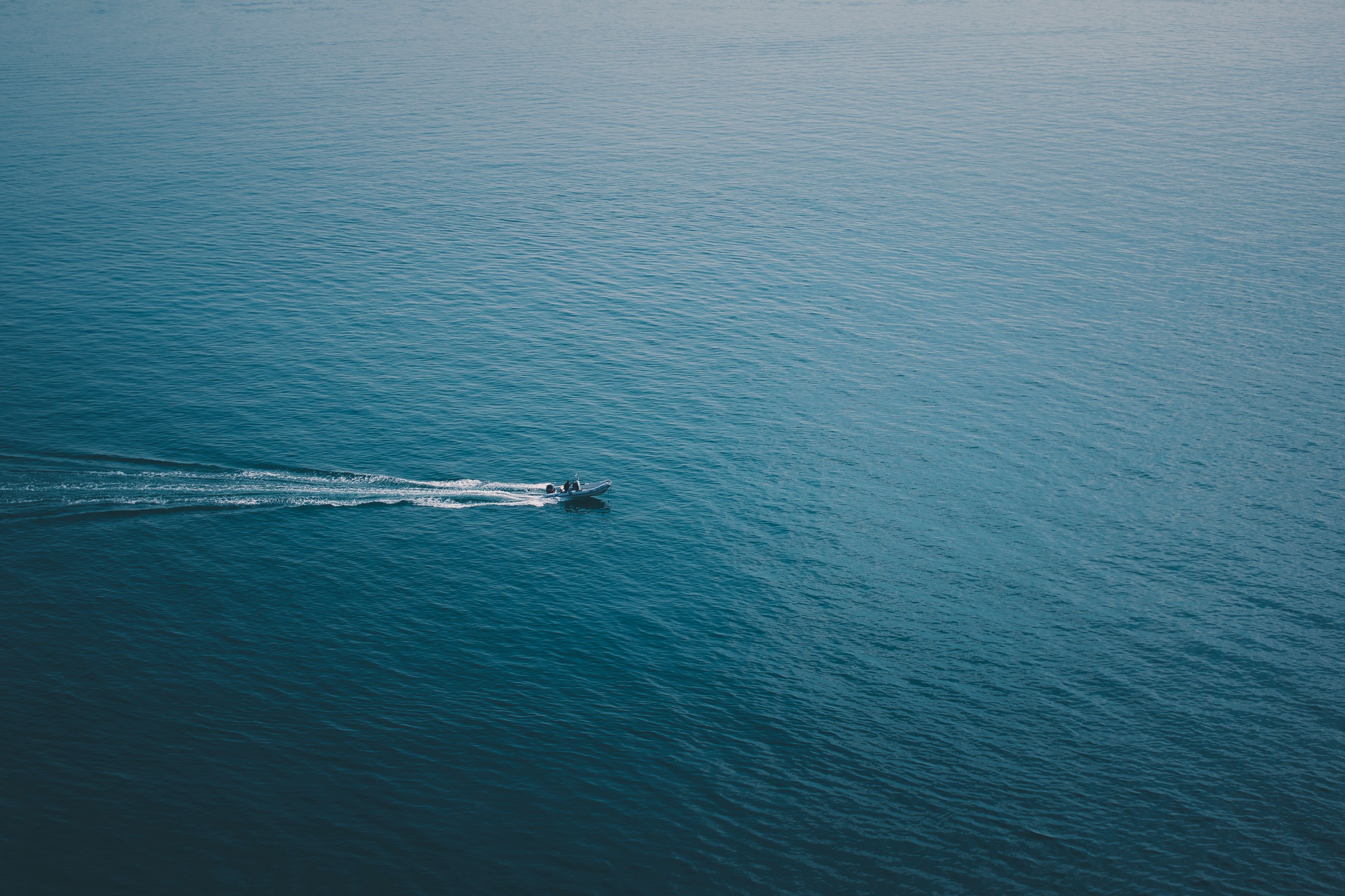 A lone boat sailing on open water, a real stock photo chosen for The Terminal List Season 2, which opens with Navy SEAL James Reece on course for Mozambique after Season 1 ends with him setting sail