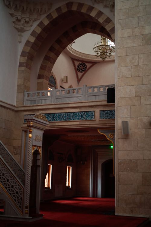 Free Explore the detailed architecture of an Ottoman-style mosque interior with stunning arches and chandeliers. Stock Photo