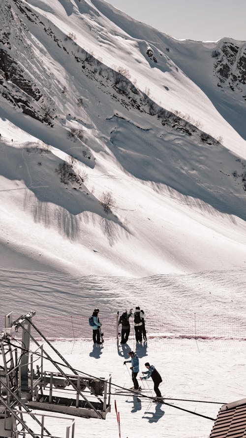 A group of people on skis on a snowy mountain