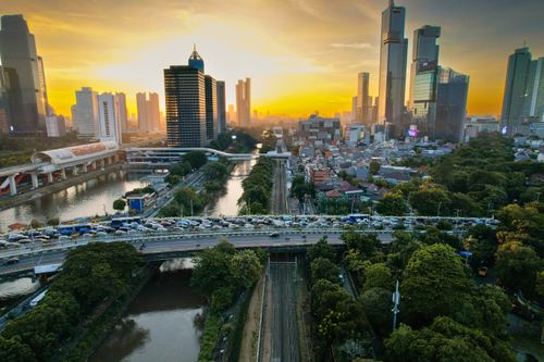 Free A stunning aerial view of South Jakarta at sunset, showcasing skyscrapers, traffic, and vibrant urban life. Stock Photo