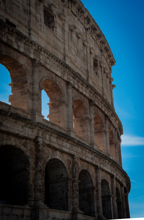 The colosseum in rome, italy by person