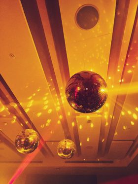 Mirror ball over a club floor — photo by HomeSickAlien on Pexels