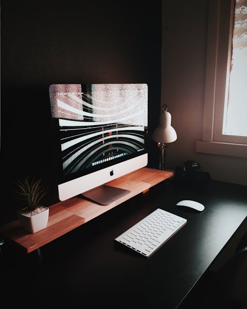 Free Silver Imac and Wireless Keyboard and Mouse Stock Photo