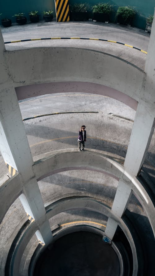 A person standing in the middle of a circular building