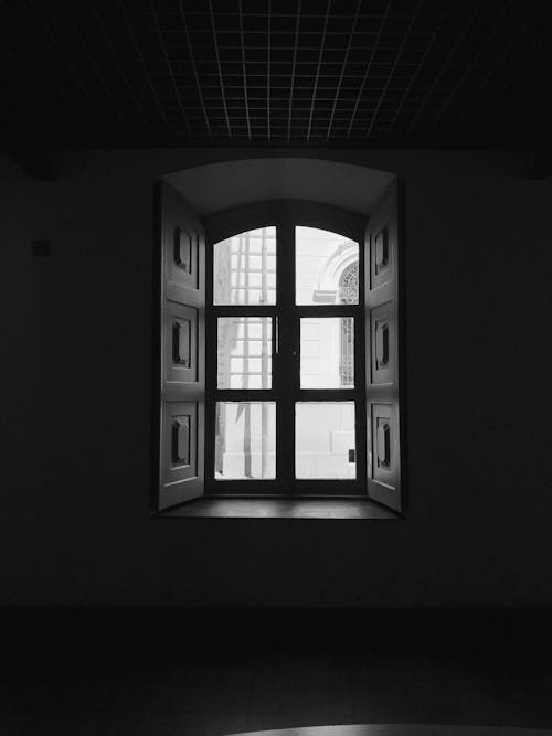 A black and white photo of a window