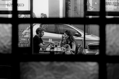 A couple sitting at a table in a restaurant