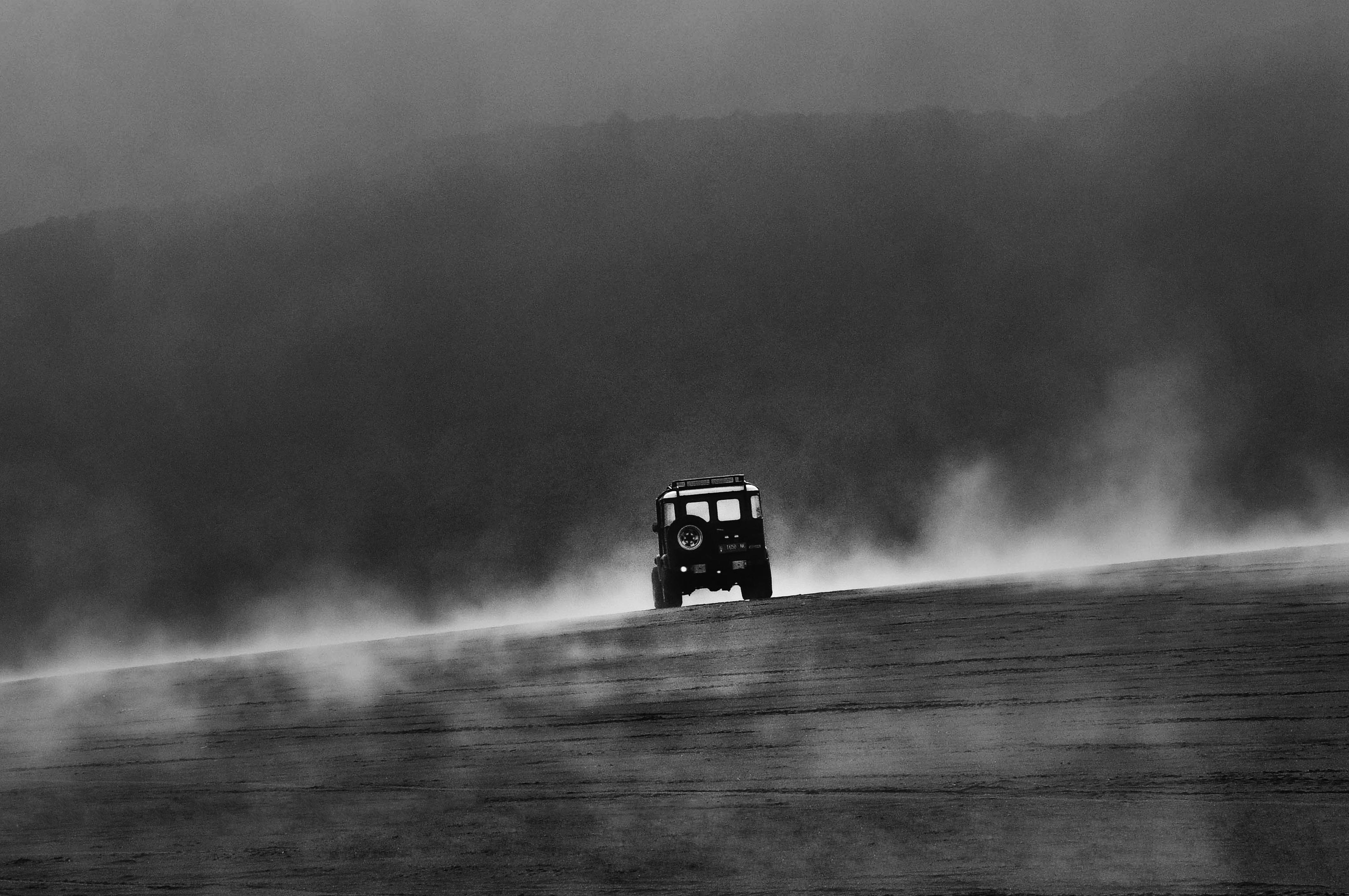 whispers in the fog jeep roaming the enigmatic dunes black and white photo abstract photography vehicle photography