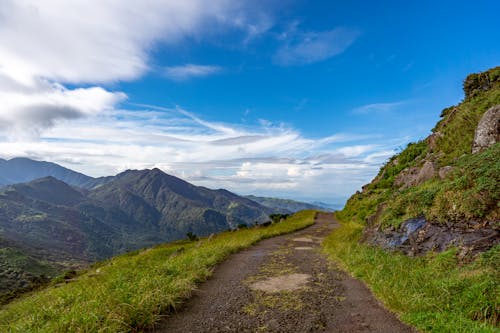 A dirt road leading to the top of a mountain