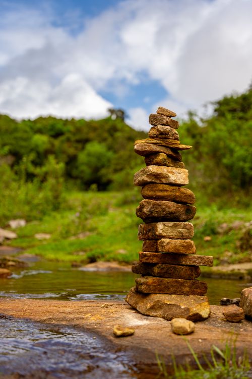 Stacking Riverbed Rocks A stack of rocks in the middle of a river · Free Stock Photo