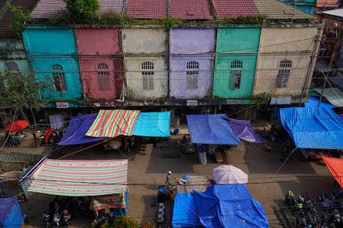 A colorful market with many tents and colorful umbrellas