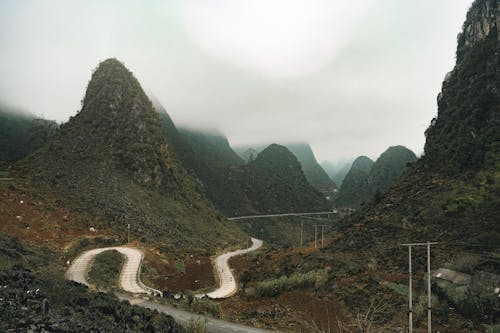 Cloud over Road in Valley in Mountains