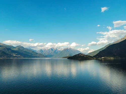 A lake with mountains in the background