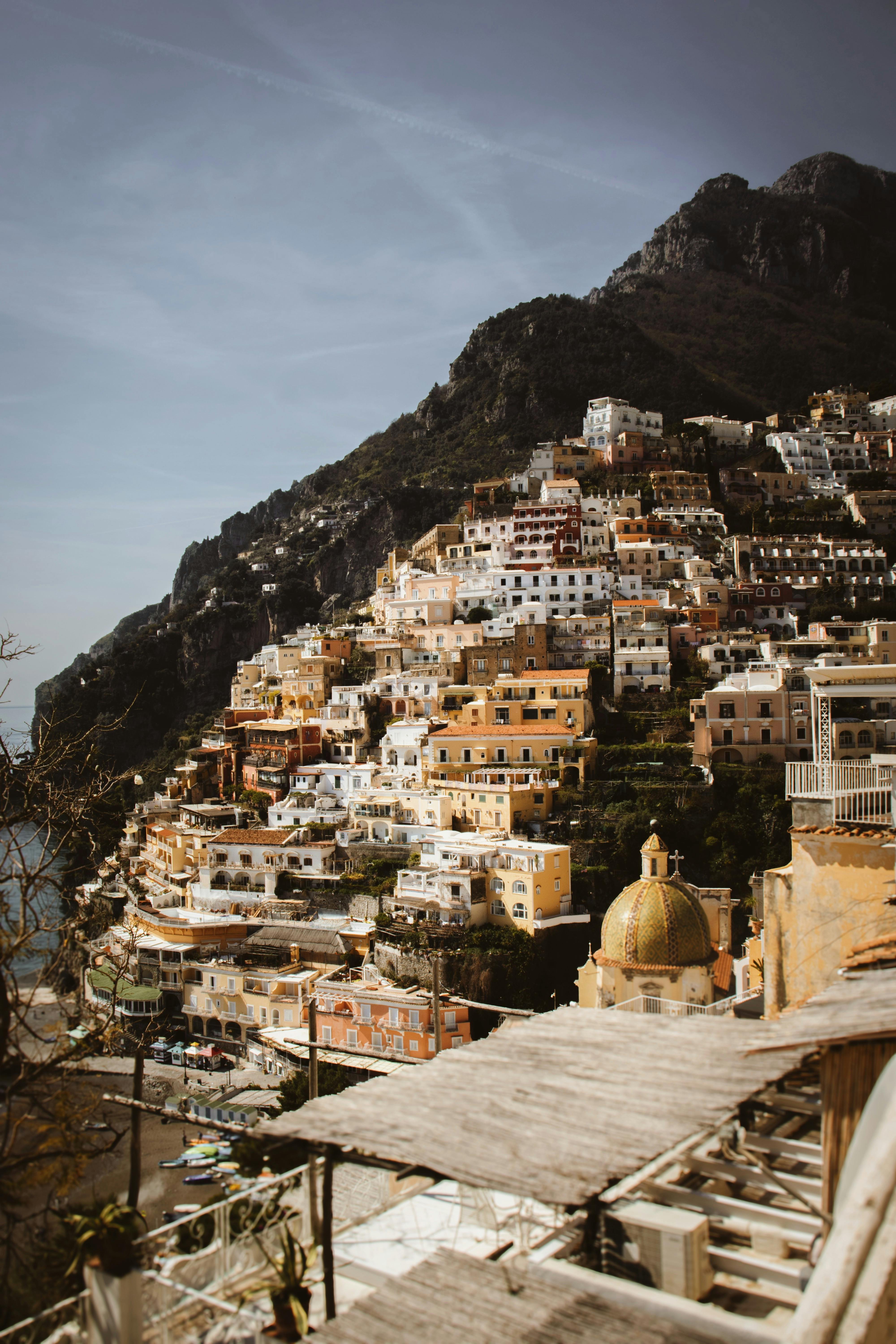 A pastel-hued town spilling down the cliffs to the sea on the Amalfi Coast, Italy