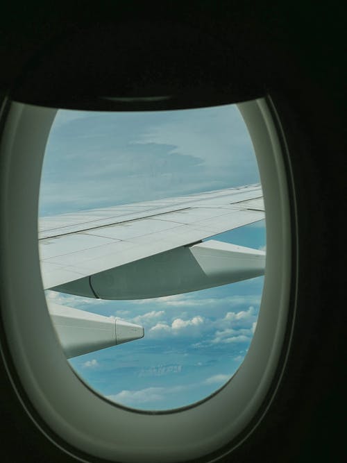A window view of an airplane wing
