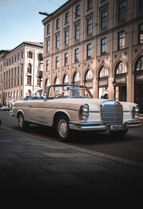 Free Elegant vintage Mercedes convertible car parked on urban street. Stock Photo