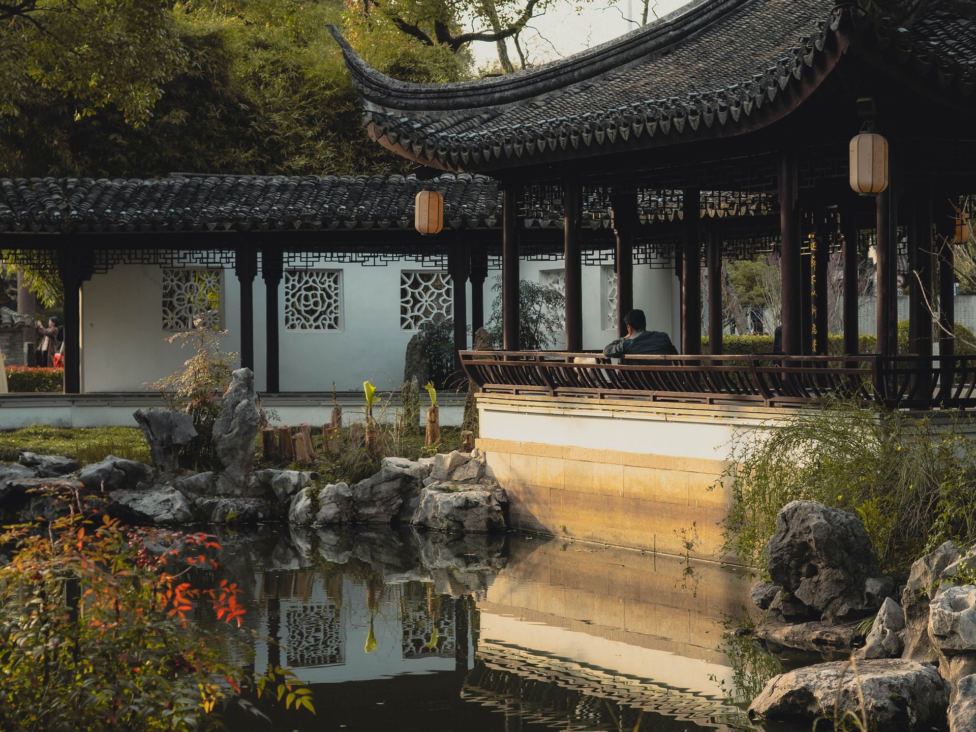 Man Sitting in Gazebo