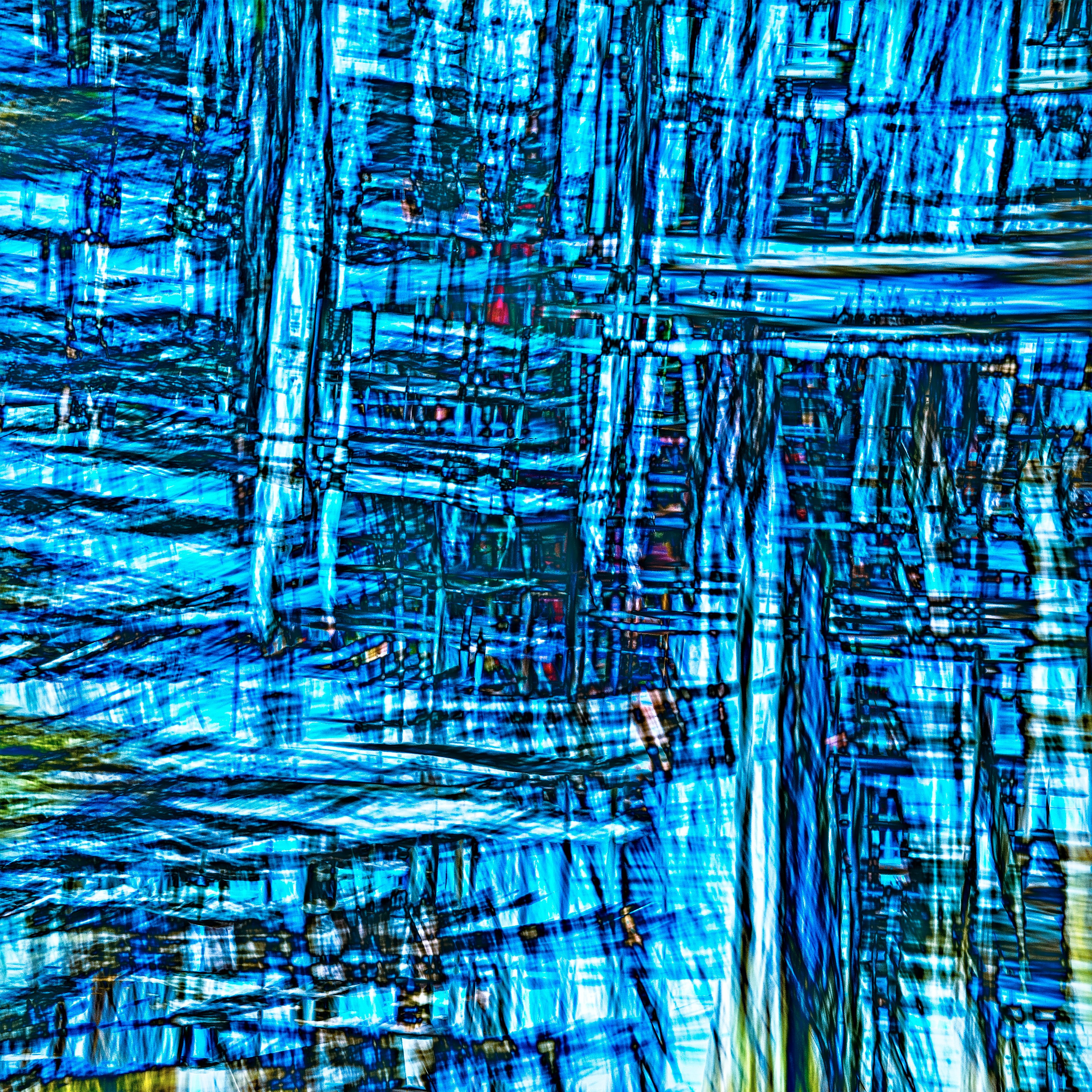 Vibrant abstract artwork featuring bold blue lines and geometric shapes.