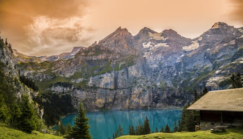 Mountains Next to Blue Lake With Trees