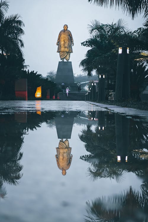 A statue of buddha in the rain