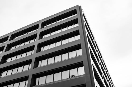 Black and white photo of a building with many windows