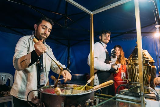 Vibrant street food scene with vendors preparing traditional treats in a lively market setting.