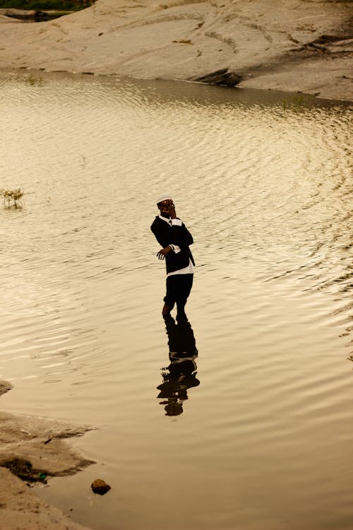 Man Standing in Lake