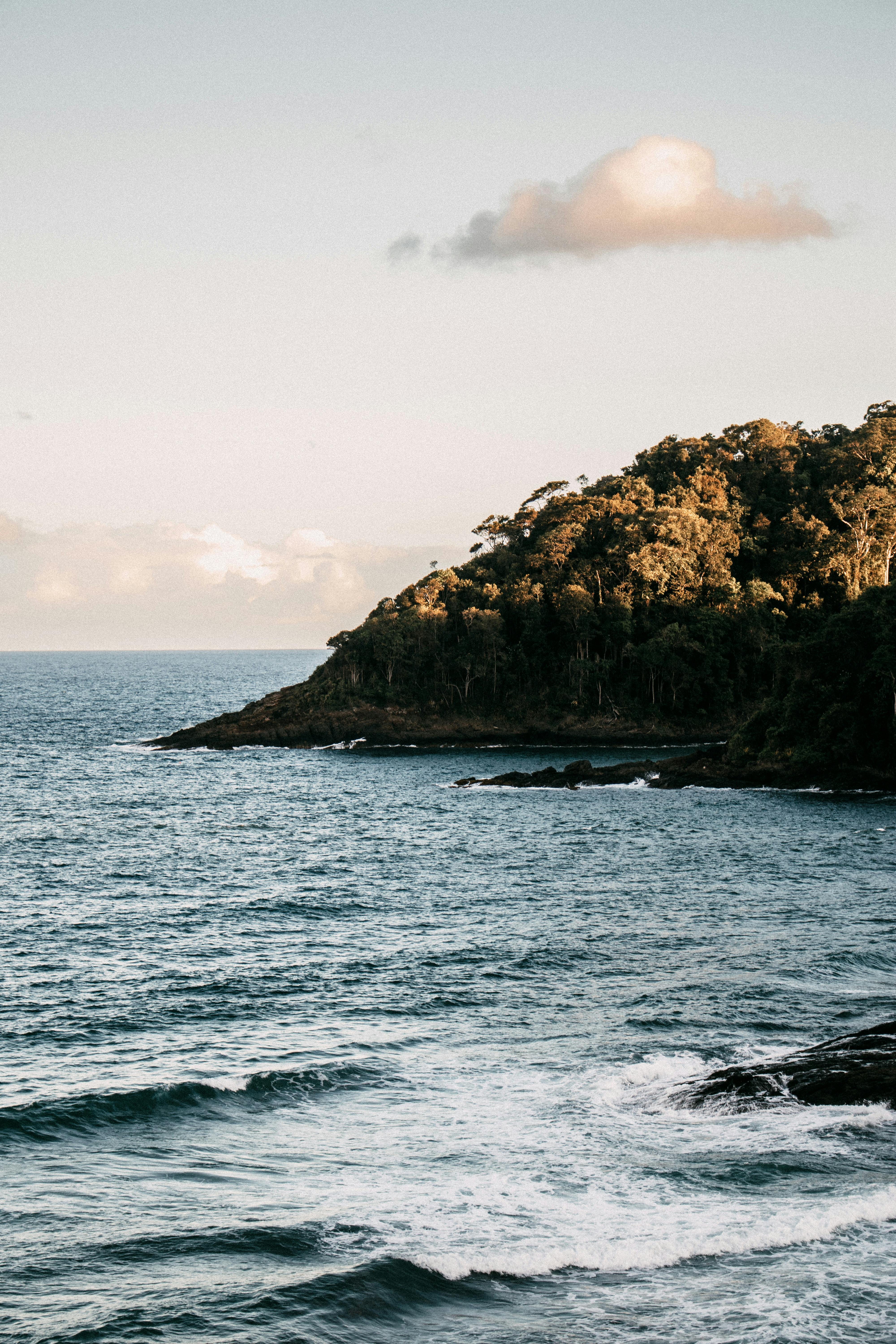Beautiful coastal landscape of Itacaré, Brazil with lush greenery and ocean waves.