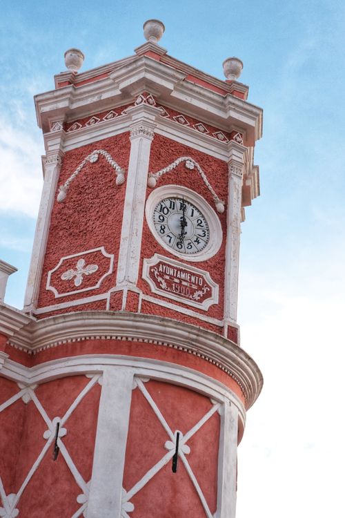Free Ornate clock tower against blue sky in Querétaro, showcasing Mexican architecture. Stock Photo
