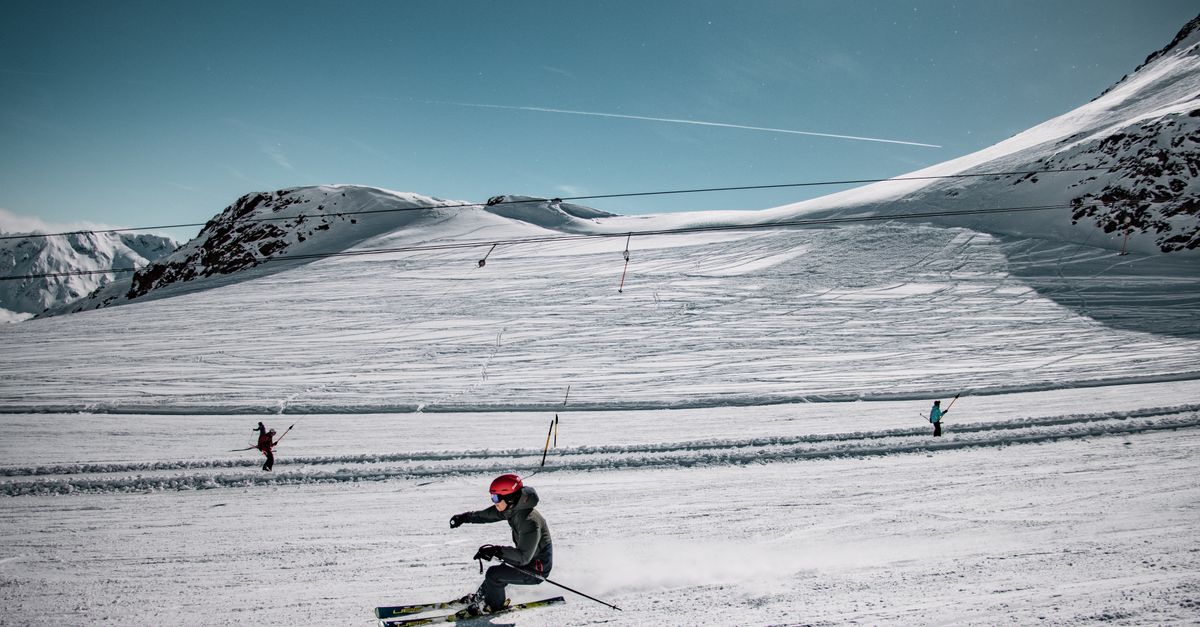Skiers enjoying a thrilling day on Sölden's snowy slopes in winter.
