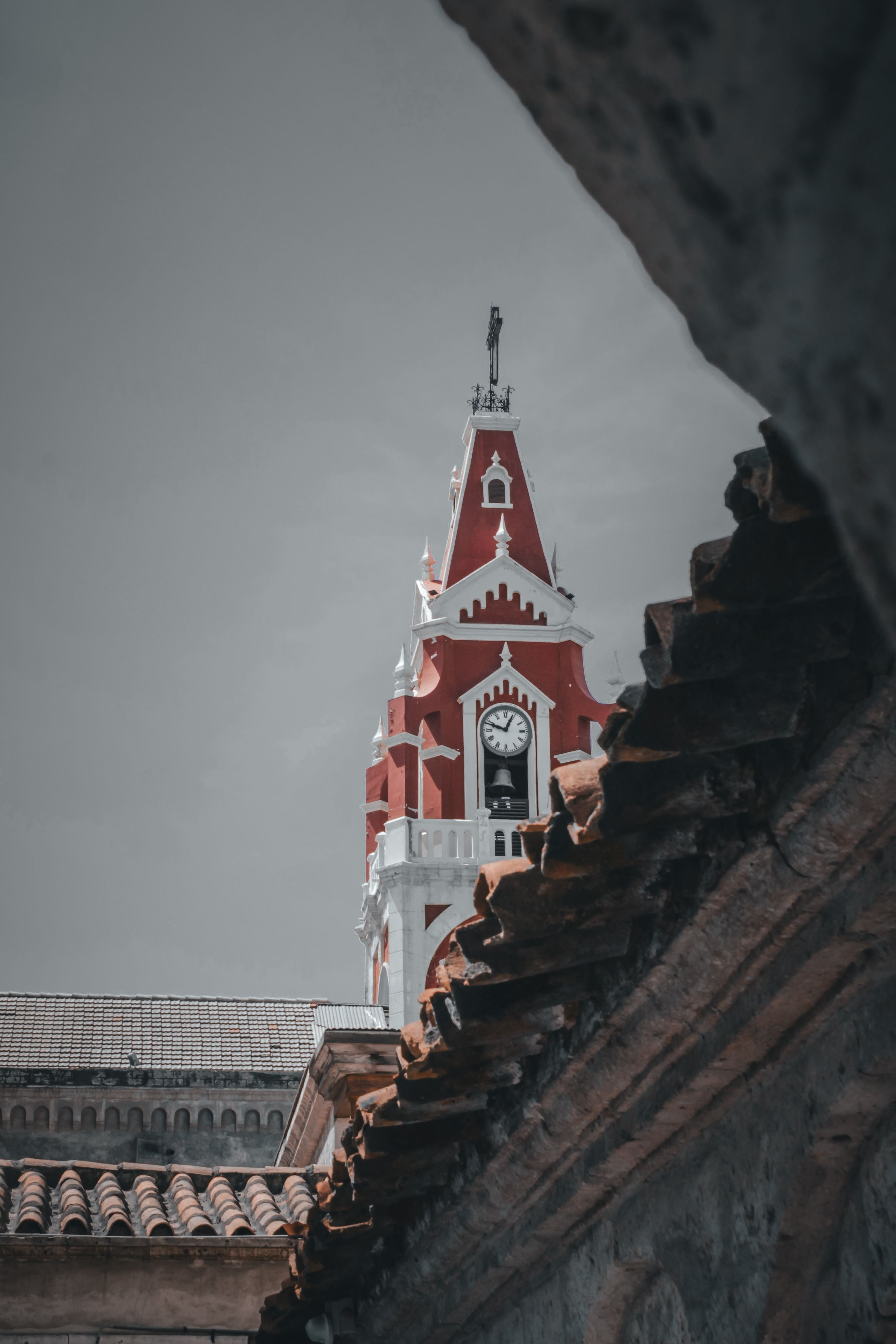 Photo of a Church Bell and Clock Tower under Blue Sky · Free Stock Photo