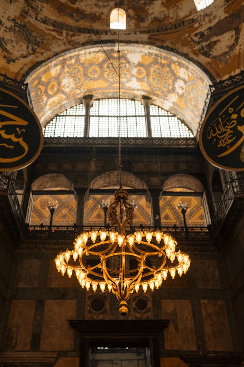 The ceiling of a building with a chandelier