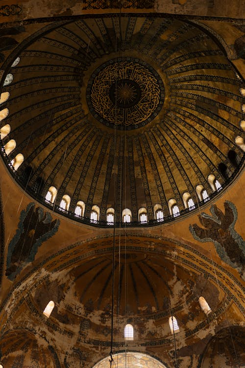 The dome of a church with a large painting on it