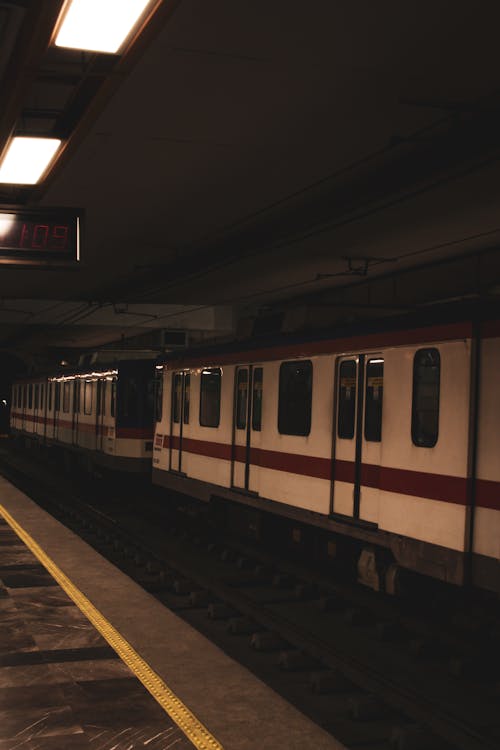 A subway train is parked at a station