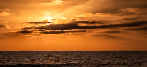 Бесплатное стоковое фото с берег океана, закат, отдых