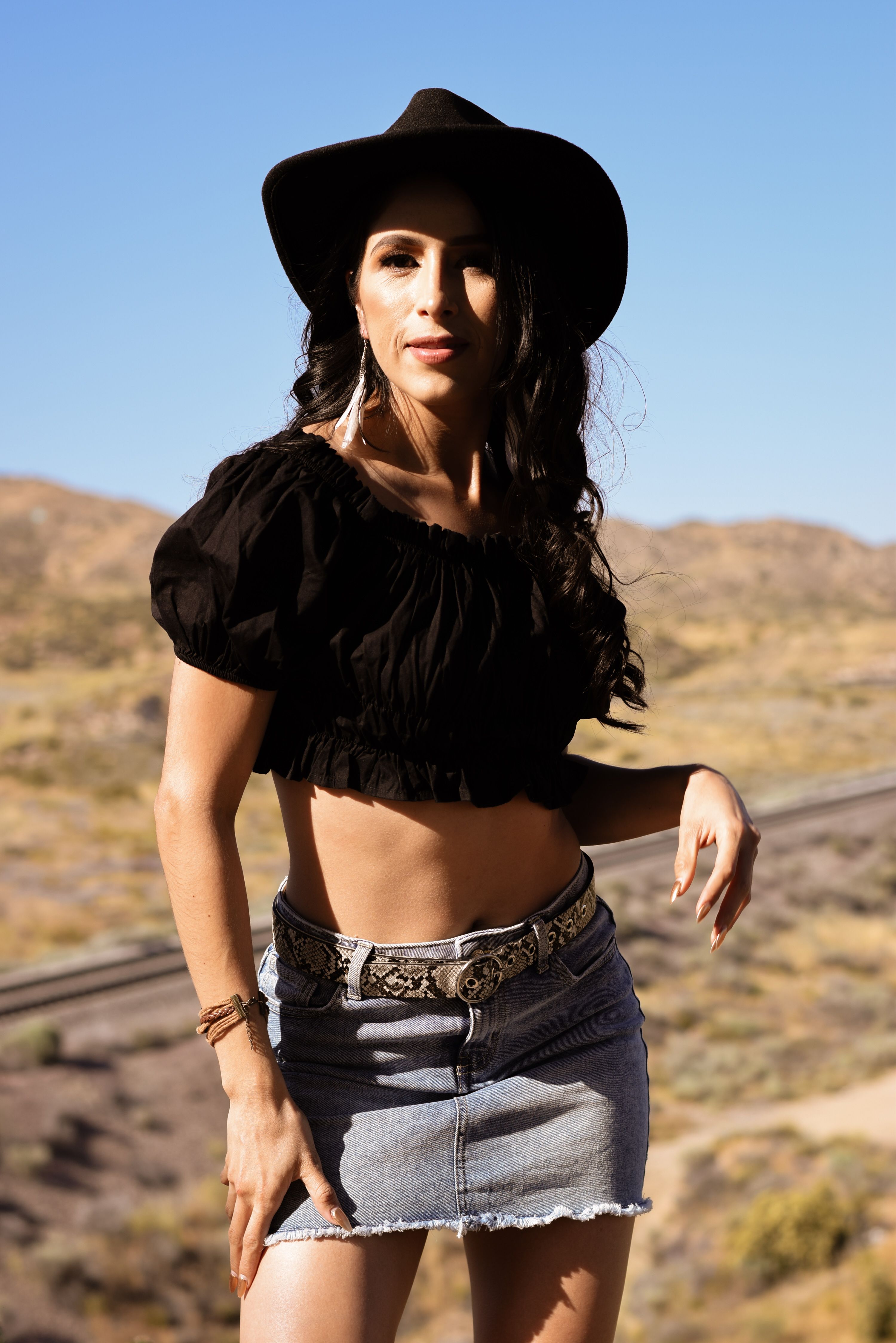 Woman Wearing a Crop Top and a Denim Skirt · Free Stock Photo