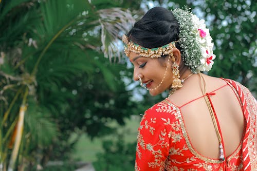 A beautiful indian bride in a red and gold sari