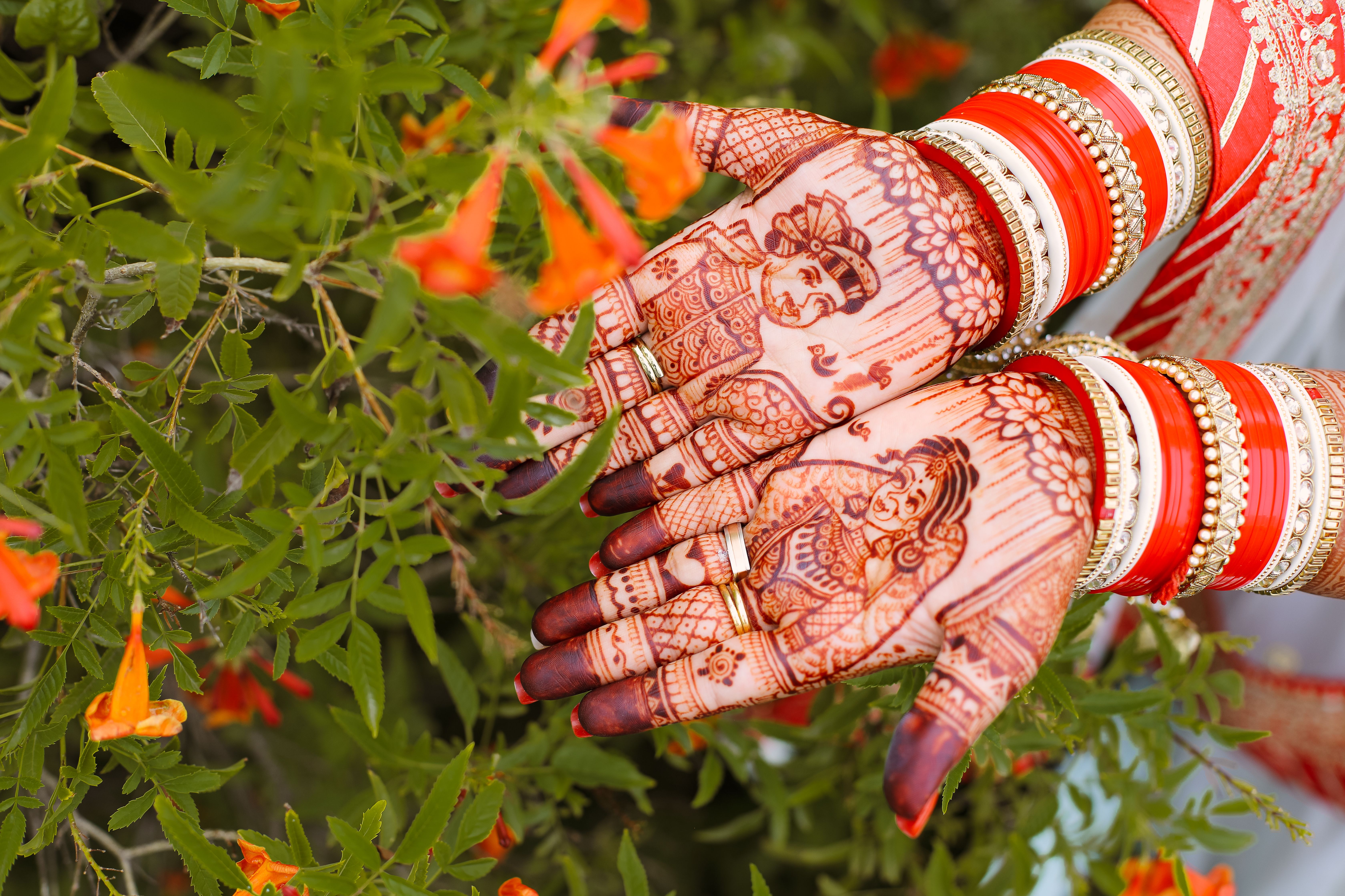 Close-up of a bride's hands with traditional henna