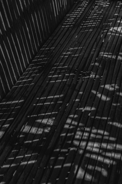 Free High-contrast abstract pattern of shadows on wooden planks. Stock Photo